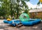 Summer, in a children`s park in a poor provincial town, activity in the form of a pool in which children can ride inside a