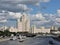 Summer cityscape with old skyscraper, bridge and river in Moscow