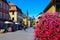 Summer cityscape of Wuzburg. Tourists and residents on a street in the center of the old city with cathedral and city hall.