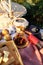 Summer coffee picnic setting in the meadow in the rays of the sunset