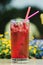 Summer cold drink outdoor. Red freshment drink with cowberry and fresh lavender at cafe terrace. Water detox with cowberry.