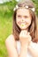 Summer is coming. Girl with butterfly on nose smelling camomile