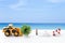 Summer concept background, women sunglass with jute hat over blurred beach background