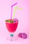 Summer concept. Fruity pink smoothies on bright colored background