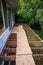 Summer construction, outdoor deck under construction, old support joists with plywood walkway on top