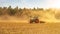 Summer countryside / agriculture harvest forest background banner panorama: old tractor milling straw grain barley wheat field,