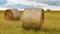 Summer countryside with haystacks in field season