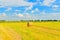 Summer countryside with haystacks in field season