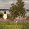 Summer countryside trees and flowers in the meadow field  and beach  ,woman on horizon , nature landscape impressionism art style