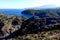 Summer: a cove cliff of cape of the Crosses in Spain with blue sea