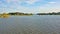 Summer day. On the calm river islets with tropical vegetation.