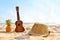 The Summer day with Guitar ukulele for relax on the beautiful beach