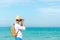 Summer Day. Happy smiling caucasian tourist asian young man holding camera