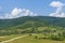 Summer day landscape with road, cloudy sky and Carpathian Mountains