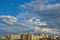 Summer daytime clouds time lapse and before sunset over a residential city quarter