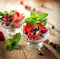 Summer dessert with strawberries on a wooden background.