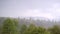 Summer downpour over the green summer mountain hills. Slow motion clip 240 fps