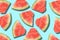 Summer drawing of red fruit watermelon slices on a light blue background