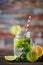 Summer drink lemonade mojito with lime, lemon and mint in jar