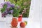 Summer drinks with fruit on a wet open window to the garden.