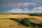 Summer end evening farmland landscape with rainbow, aerial