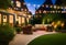 Summer evening on the patio of beautiful suburban house with lights in the garden garden