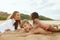 Summer. Family On Beach Having Fun. Mother And Little Girl Making Funny Faces Brother. Young Woman With Children.