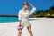 Summer fashion. Sexy fashion model. Glamour female model in summer sporty beachwear near the Maldives ocean. Travel model in a