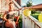 Summer feeling on the balcony: Close up of lampions, smiling girl in the blurry background