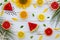 Summer flatlay background. Bright citrus composition from watermelon, grapefruit, orange, sunflower, leaves, mint