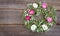 Summer flower wreath on wooden background