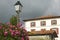 Summer flowers, lamp post and home in Sare, France in Basque Country on Spanish-French border, a hilltop 17th century village in