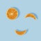 Summer fresh fruit smiling face creative concept on pastel blue background. Healthy orange pool party