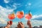 Summer freshness cocktails in hands against clear sky. Generative AI.