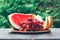 Summer fruit berry still life with slices of watermelon, melon and grape bunch