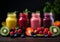 Summer fruit in colorful smoothies in glass bottles. Healthy diet
