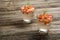 Summer fruit drinks. Fresh lemonade with oranges pieces on rustic wooden background