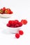 Summer fruits concept strawberry and rasberry in ceramic cup on