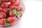 Summer fruits. Home strawberry in bowl with water with copy space