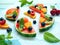 Summer fruits salad. Slices of watermelon with apricot, orange, blueberries, cherries and mint leaves.