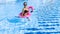 Summer fun beach. Young sexy woman with inflatable pink flamingo in bikini swimsuit, sunglasses float in blue pool water. Spa and