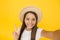 Summer fun. teen girl greeting summer. little beauty in straw hat make selfie. beach style for kids. happy summer