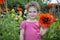 In summer, the garden is a little girl in the poppies.