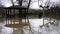 the summer gazebo in the park is flooded with water.