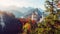 Summer Germany. Morning in the Bavarian Mountains. Castle Neuschwanstein in the light of the rising sun. Awesome alpine highlands