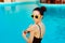 Summer Girl Applying Suncream Lotion by the Pool