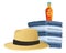 Summer hat and sun bronzer on towels piled