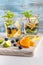 Summer healthy cocktails of citrus infused waters, lemonades or mojitos, with lime lemon orange blueberries and mint, diet detox