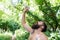 Summer heat. Man thirsty sweaty hipster naked in forest. Heat concept. Bearded tattooed guy relax in nature hot summer