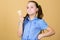 Summer is here. Girl little child eat ice cream cone beige background. Delicious ice cream. Happy childhood. Carefree